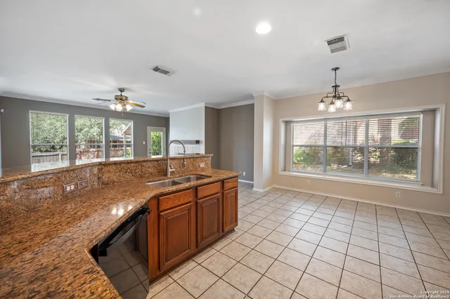 a bedroom with bed and a potted plant
