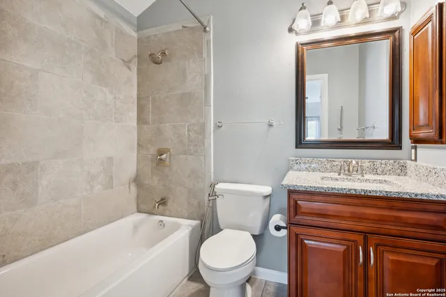 a view of a hallway with wooden floor and stairs