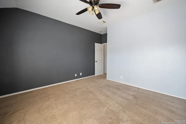 a bathroom with a granite countertop sink a mirror and a bathtub