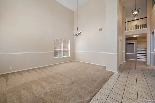 a bathroom with a granite countertop toilet a sink and a mirror