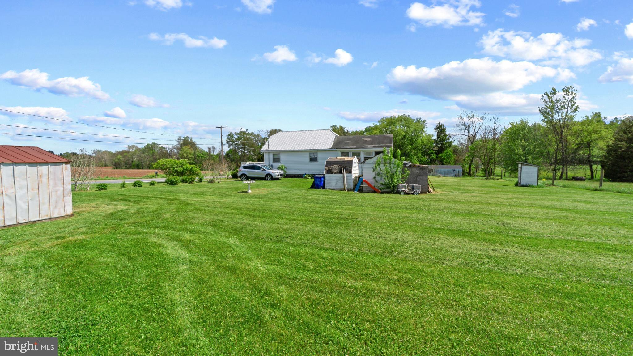7549 Utica Road Thurmont, MD 21788 - Photo 3 of 5 a view of a green field with house in the background