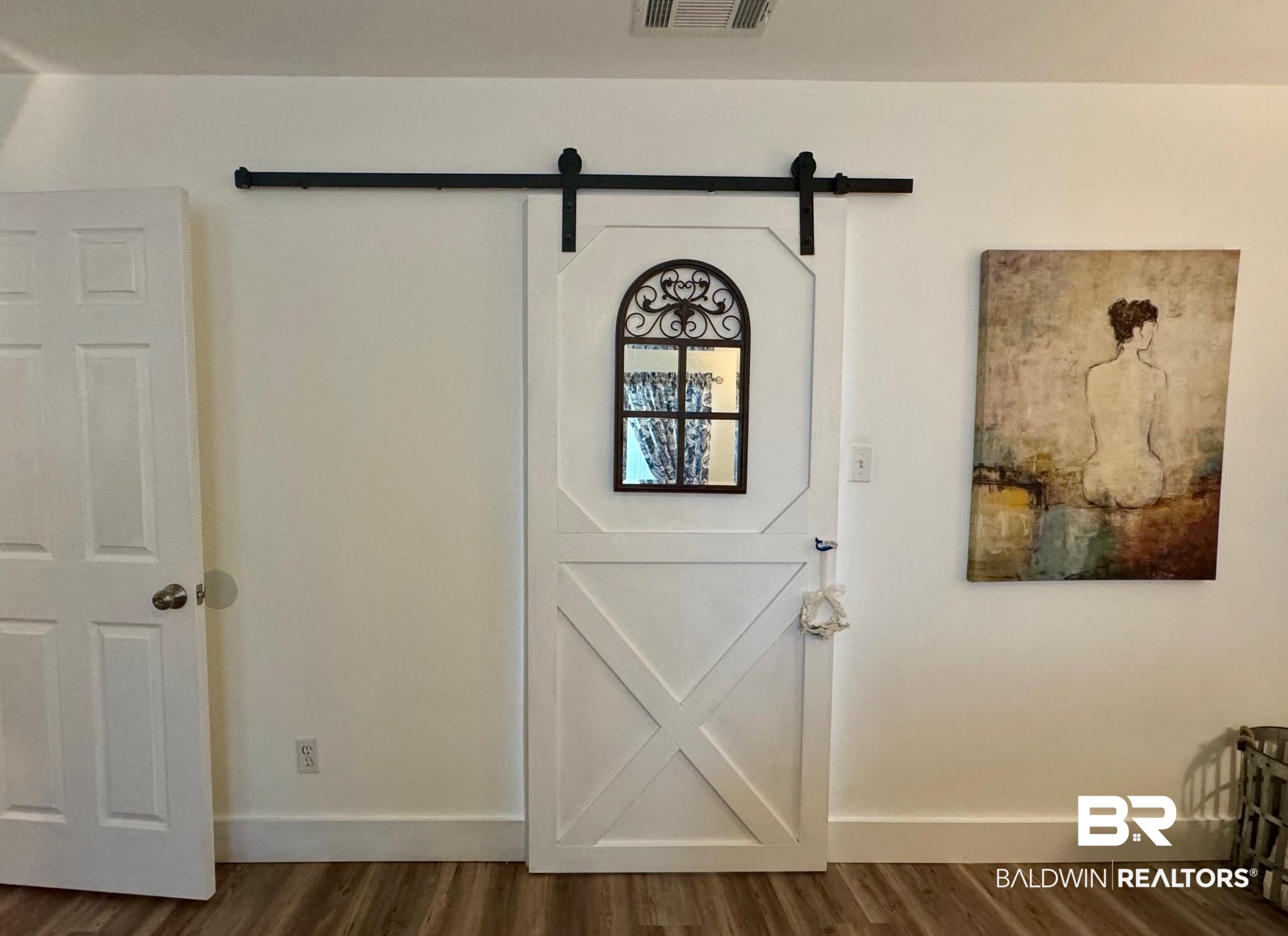 3200 Loop Road, Unit 55 Orange Beach, AL 36561 - Photo 15 of 40 Entryway with dark wood-type flooring and a barn door