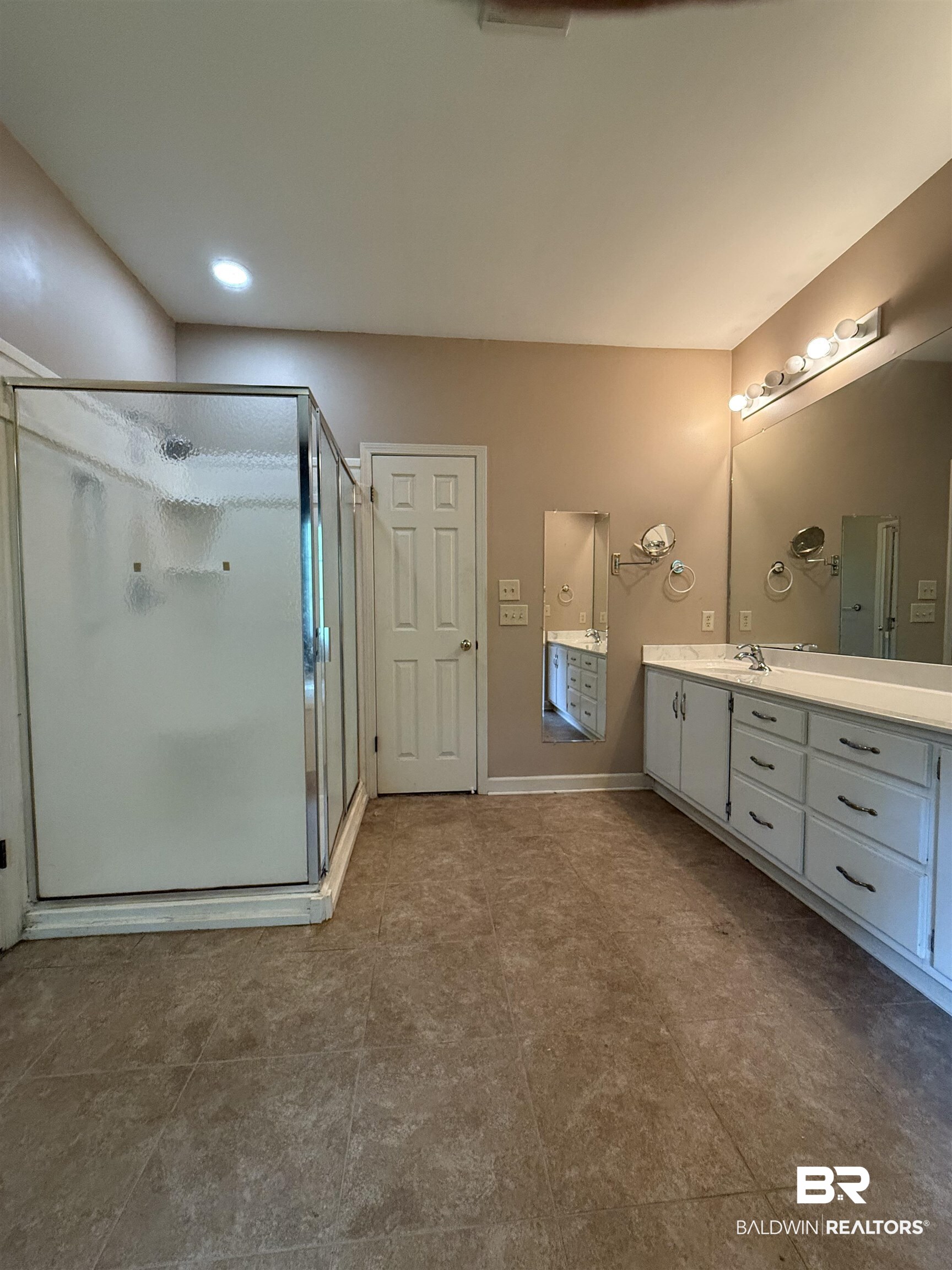 295 Norwood Road Monroeville, AL 36460 - Photo 13 of 32 Full bath with vanity, a shower stall, baseboards, and tile patterned floors
