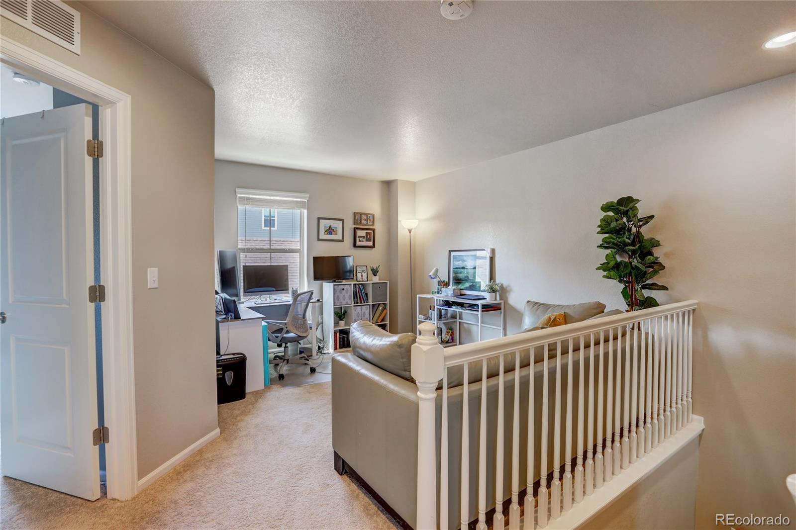 10321 Bellwether Lane Lone Tree, CO 80124 - Photo 15 of 32 a view of a livingroom with furniture and windows