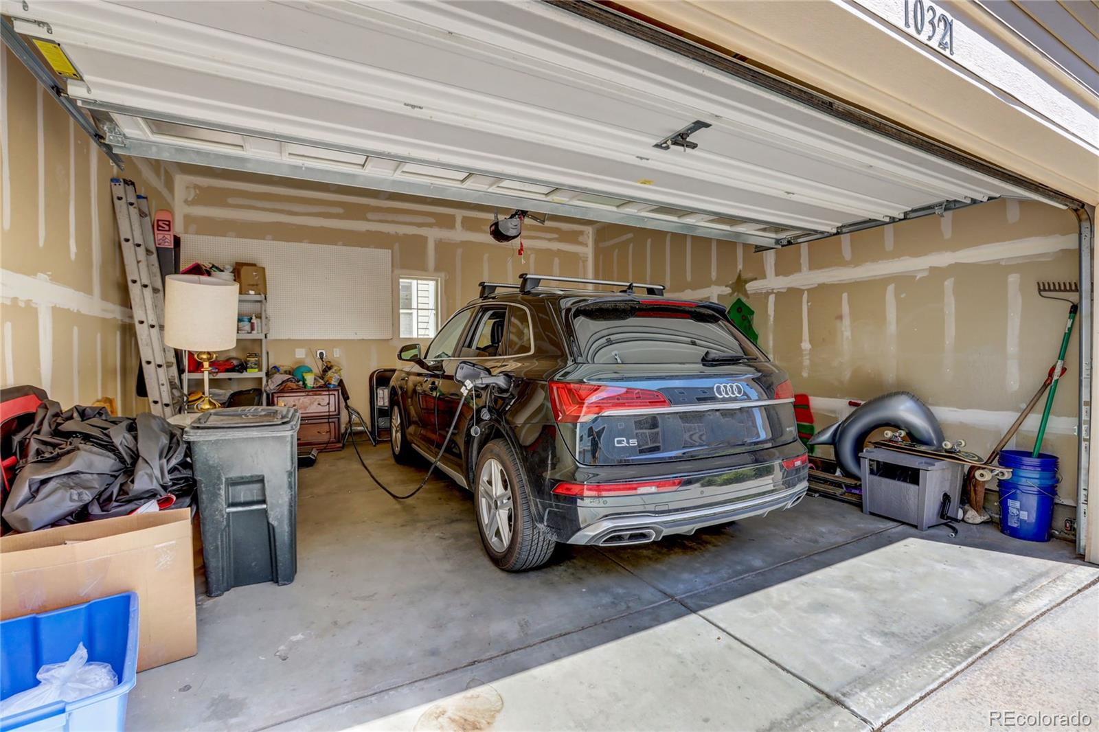 10321 Bellwether Lane Lone Tree, CO 80124 - Photo 25 of 32 a bedroom with bed and a car parked
