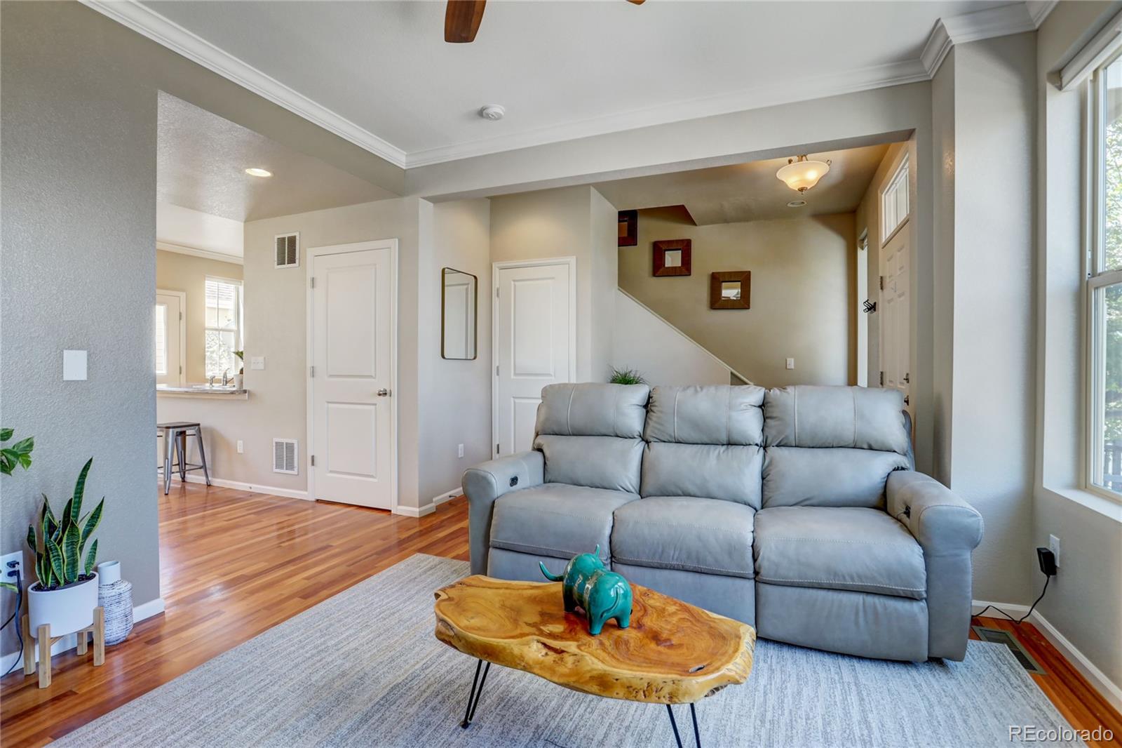 10321 Bellwether Lane Lone Tree, CO 80124 - Photo 6 of 32 a living room with furniture and a wooden floor