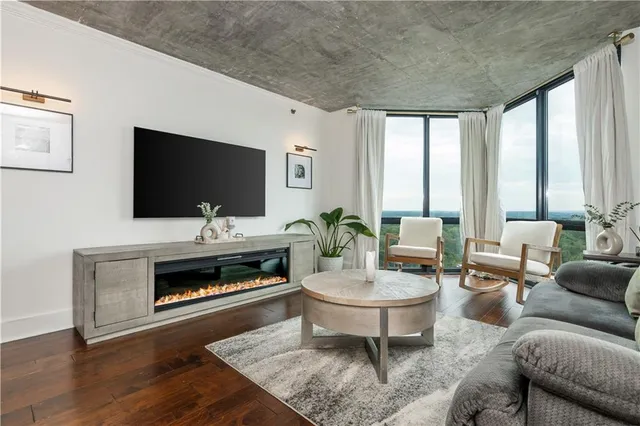 a living room with furniture and a flat screen tv