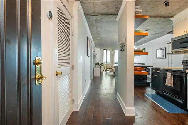 a kitchen with stainless steel appliances a stove and a microwave