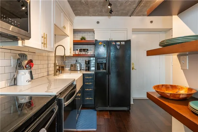 a kitchen with a table and chairs in it
