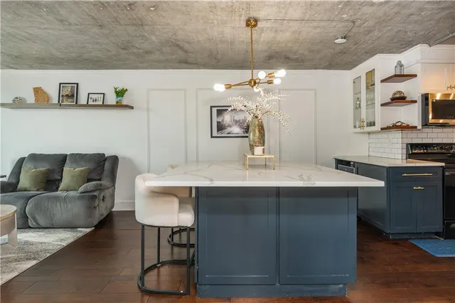 a living room with furniture and a large mirror