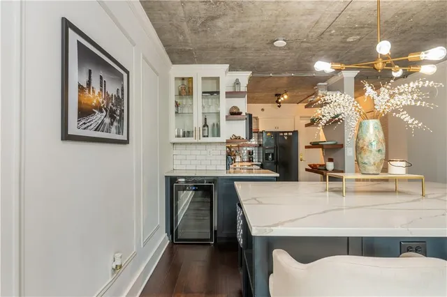 a bedroom with a bed and a ceiling fan