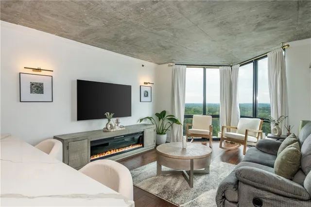 a view of walk in closet with clothes