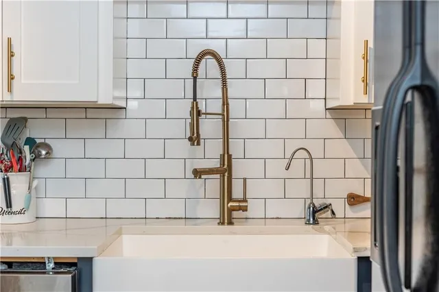 a view of a house with swimming pool and sitting area