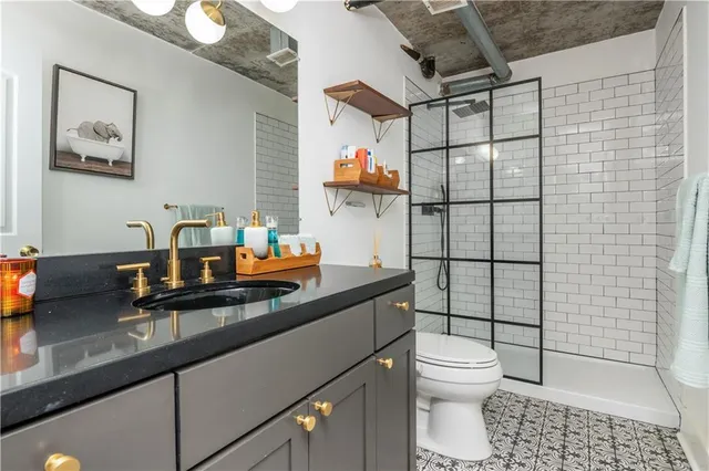 a living room with furniture a flat screen tv and a large window