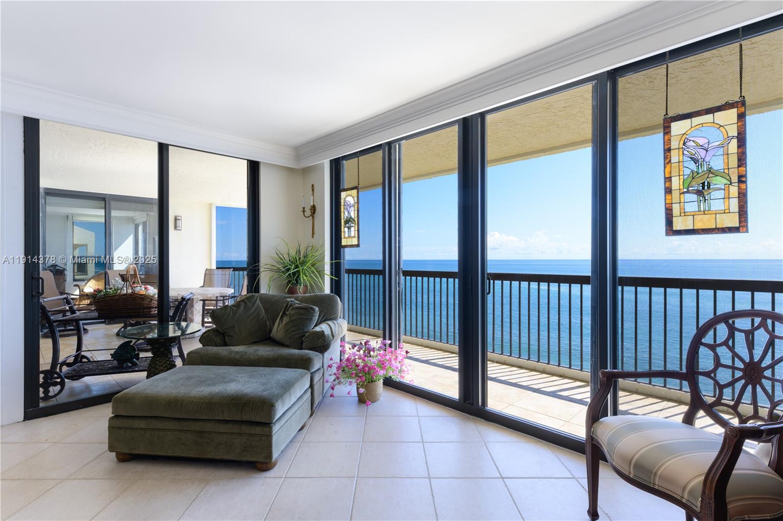 19670 South Beach Road, Unit PHB3 Tequesta, FL 33469 - Photo 17 of 38 a living room with furniture and a floor to ceiling window