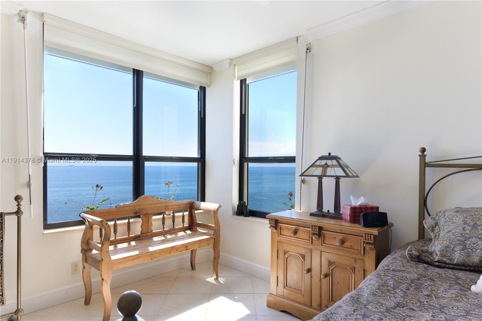 19670 South Beach Road, Unit PHB3 Tequesta, FL 33469 - Photo 26 of 38 a bedroom with furniture and a window