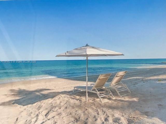 19670 South Beach Road, Unit PHB3 Tequesta, FL 33469 - Photo 33 of 38 a chair and table in the ocean