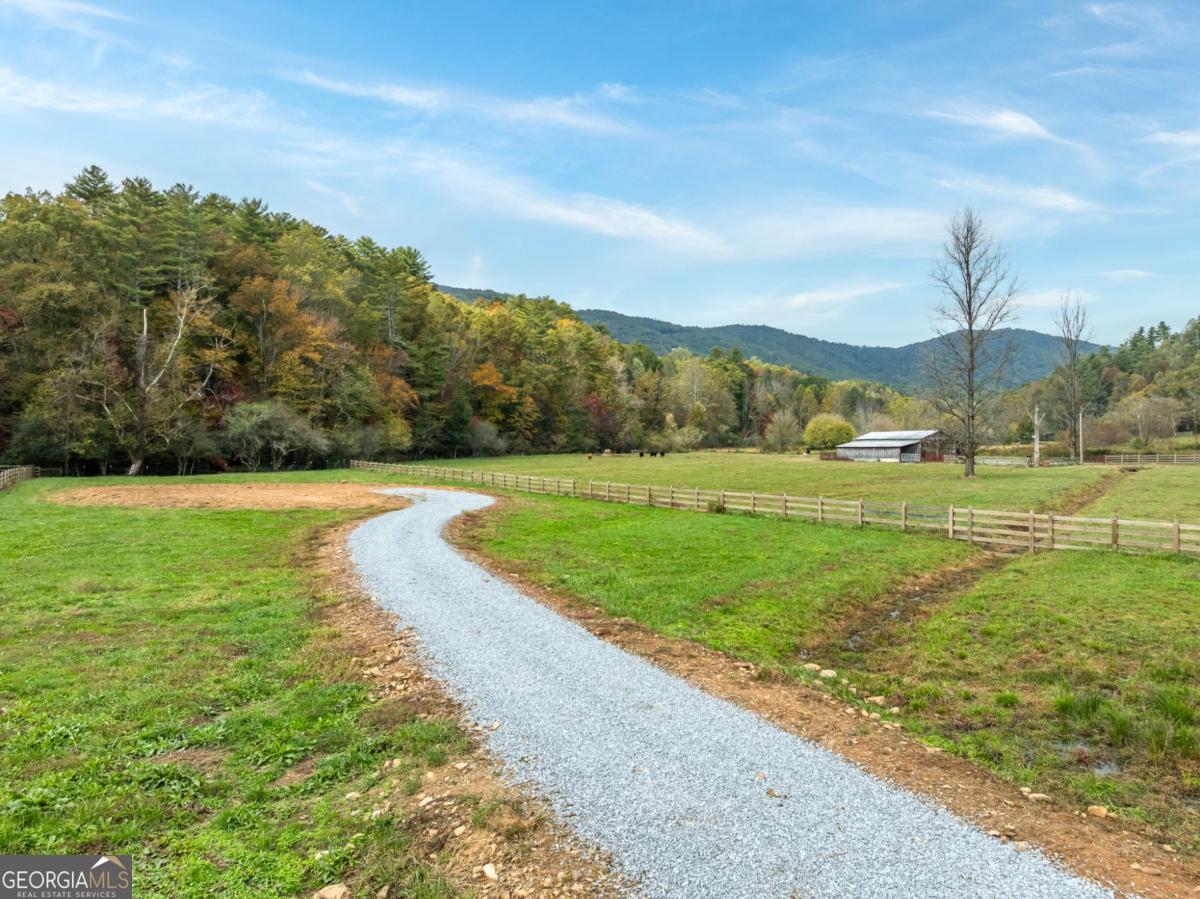 2673 Tails Creek Church Road Ellijay, GA 30540 - Photo 17 of 23 a view of a golf course with a lake