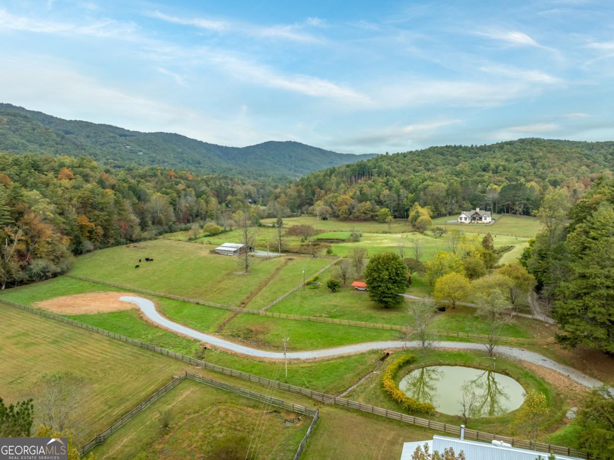 2673 Tails Creek Church Road Ellijay, GA 30540 - Photo 21 of 23 a view of a swimming pool with a mountain view