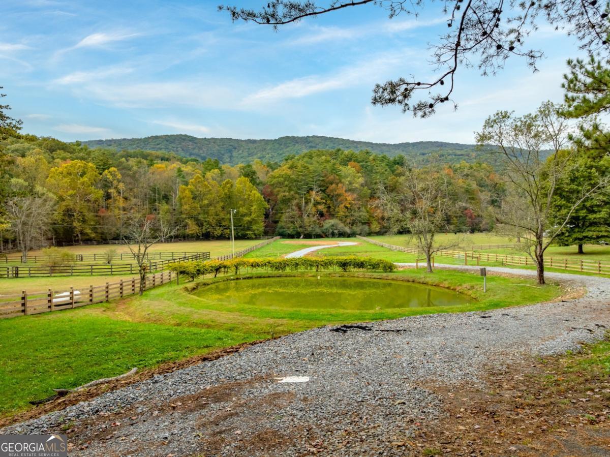 2673 Tails Creek Church Road Ellijay, GA 30540 - Photo 5 of 23 a view of a golf course with a lake view