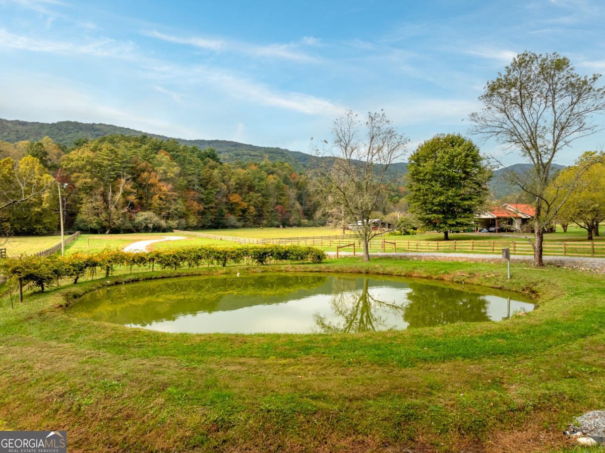 2673 Tails Creek Church Road Ellijay, GA 30540 - Photo 6 of 23 a view of a swimming pool with an ocean view