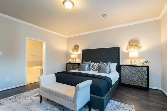 a bedroom with a bed and a couch