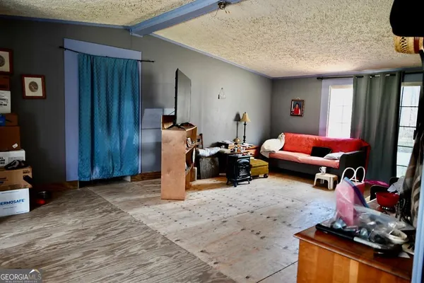 a gym room with furniture and a wooden floor