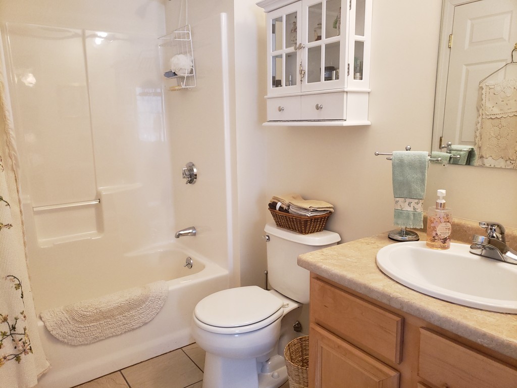 159 Allen Road, Unit 20 Billerica, MA 01821 - Photo 8 of 17 a bathroom with a sink a toilet and shower