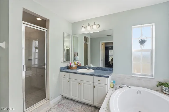 a bedroom with two beds and a window