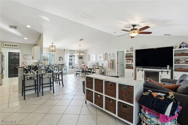 a view of a livingroom with furniture and a flat screen tv
