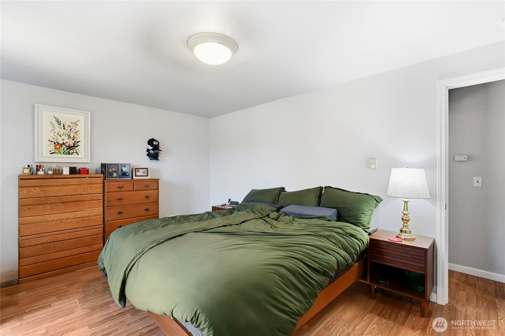 2533 Fir Avenue Bremerton, WA 98310 - Photo 16 of 38 a bedroom with a bed and wooden floor