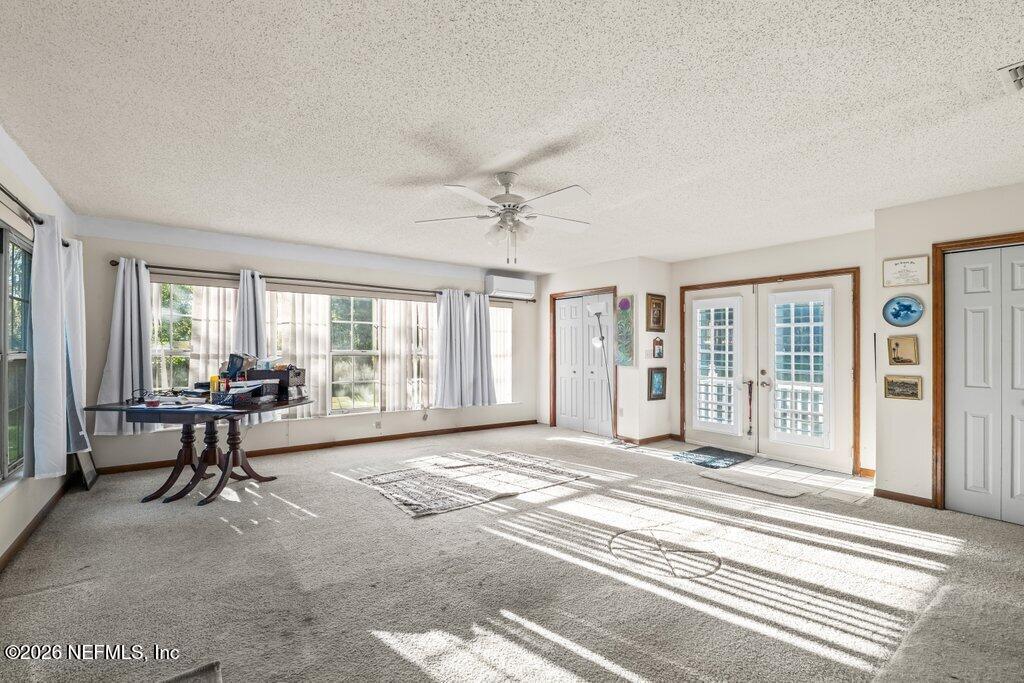 1226 Halifax Road Jacksonville, FL 32216 - Photo 11 of 27 a living room with furniture and a window