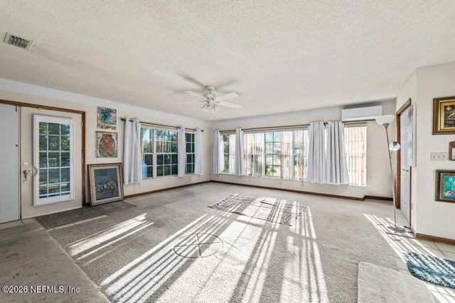 a bedroom with 2 bed and a table