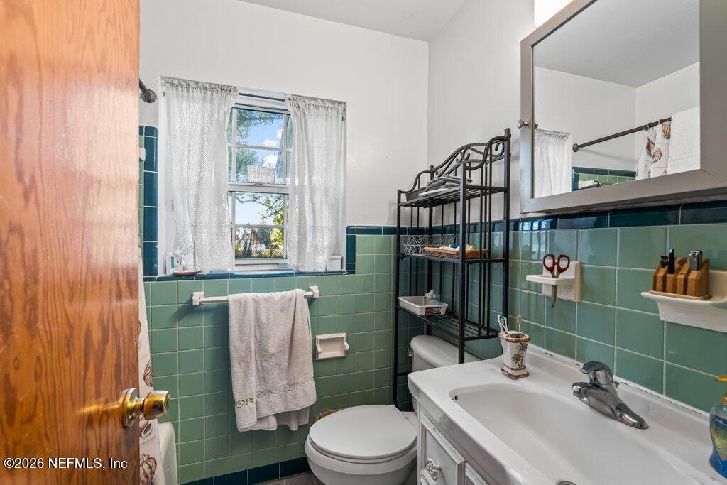 1226 Halifax Road Jacksonville, FL 32216 - Photo 15 of 27 a bathroom with a sink a toilet and shower