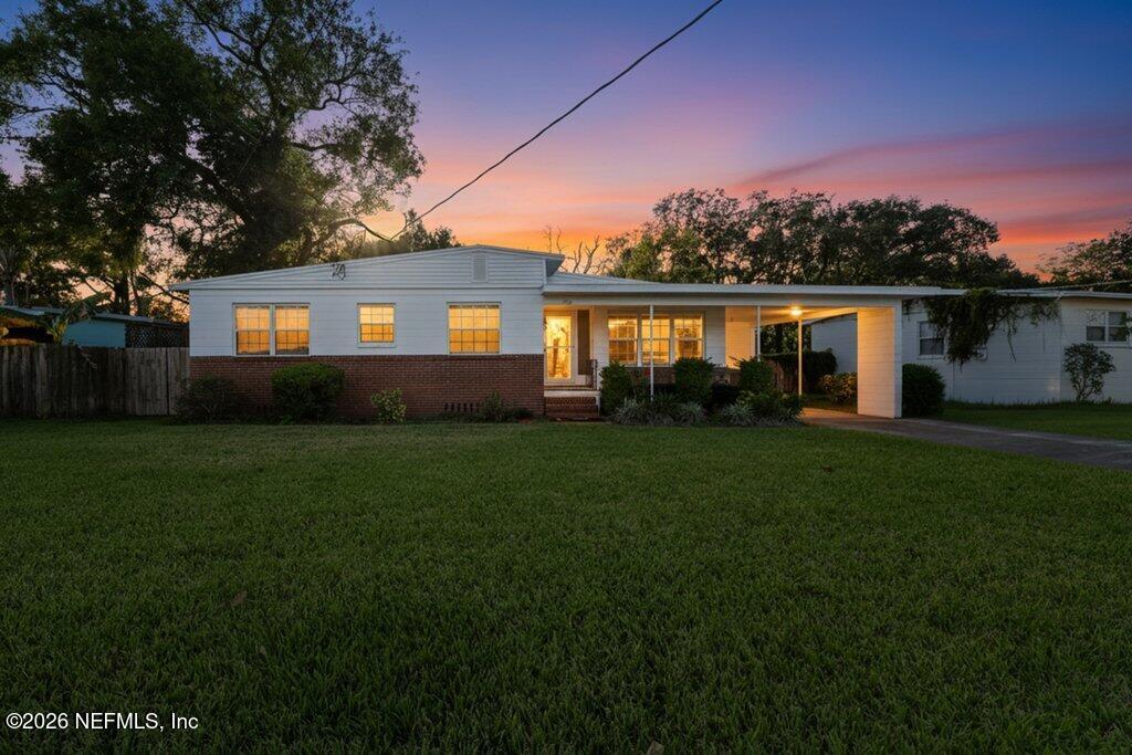 1226 Halifax Road Jacksonville, FL 32216 - Photo 26 of 27 a front view of house with yard and green space