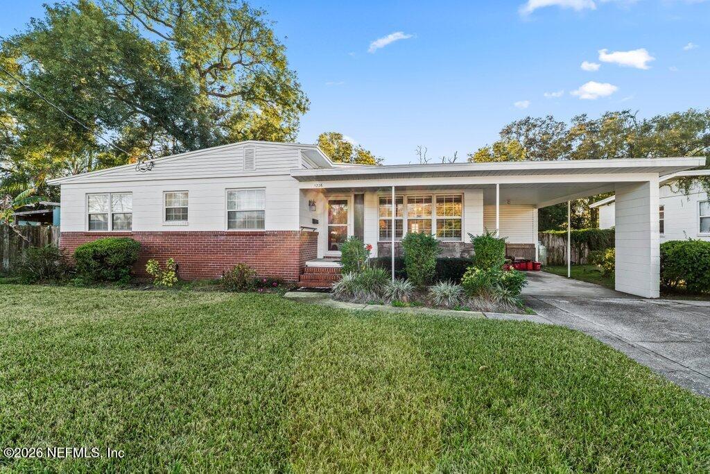 1226 Halifax Road Jacksonville, FL 32216 - Photo 3 of 27 front view of a house with a yard