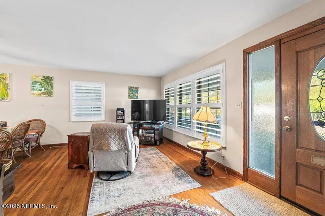 a living room with furniture and a flat screen tv