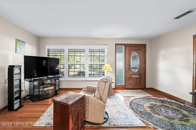 a living room with furniture and a window