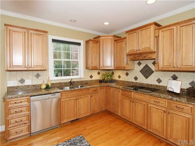 12409 Canolder Street Raleigh, NC 27614 - Photo 7 of 24 Newly Updated Kitchen offering Granite Countertops and Tile Backsplash Kitchen