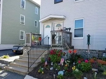 a view of front door and potted plants
