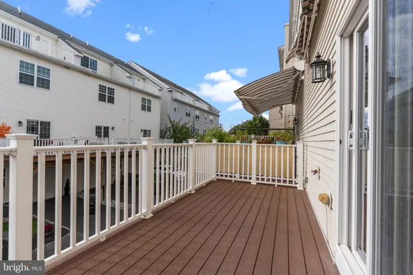 a view of a balcony with wooden floor