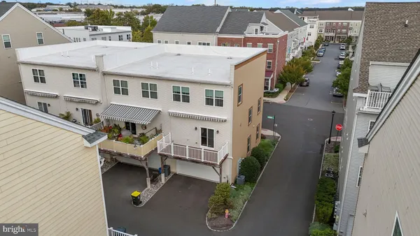 an aerial view of a house with garden space and sitting area