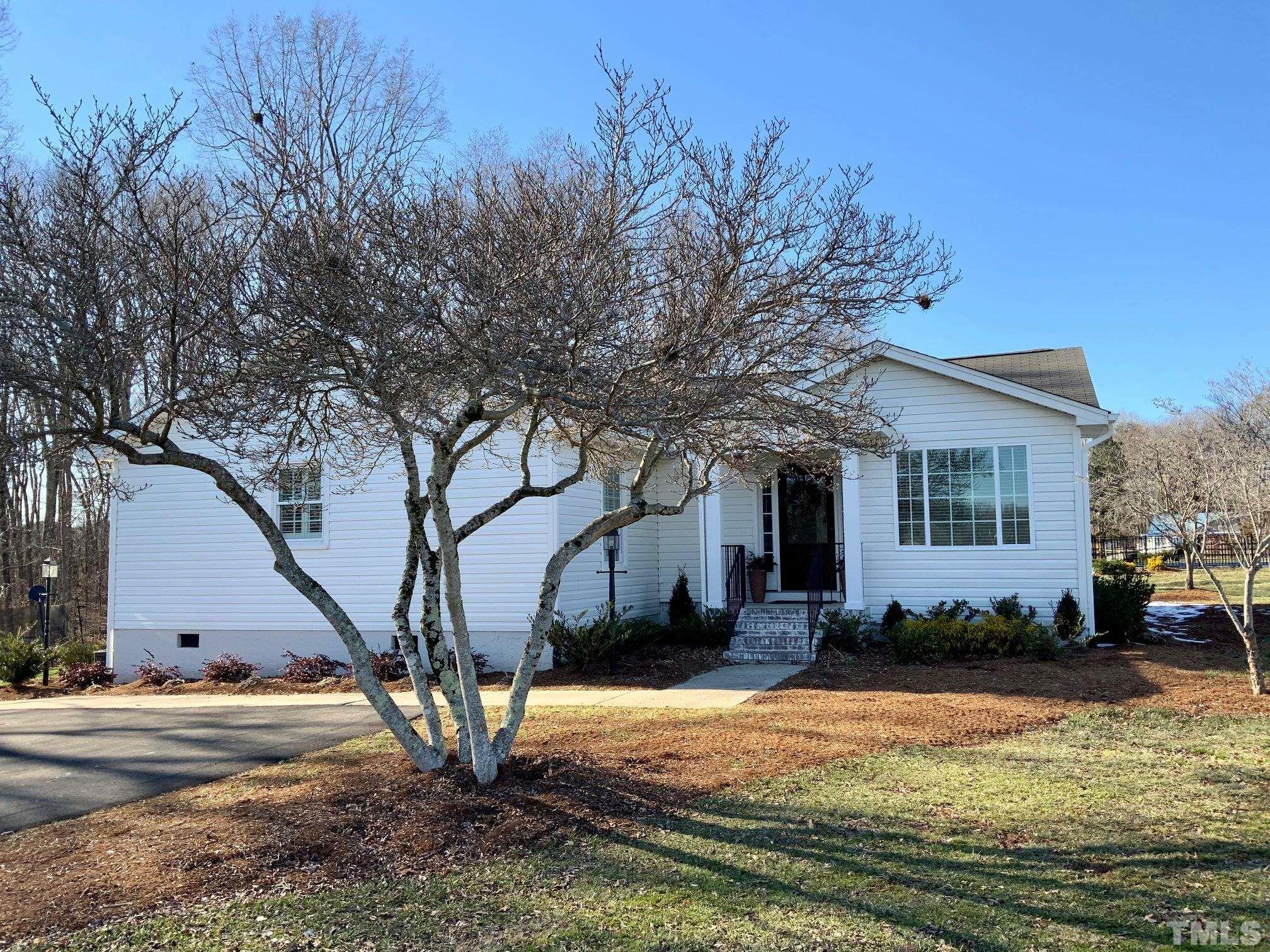 5514 Guess Road Rougemont, NC 27572 - Photo 2 of 21 a front view of house with yard and trees around