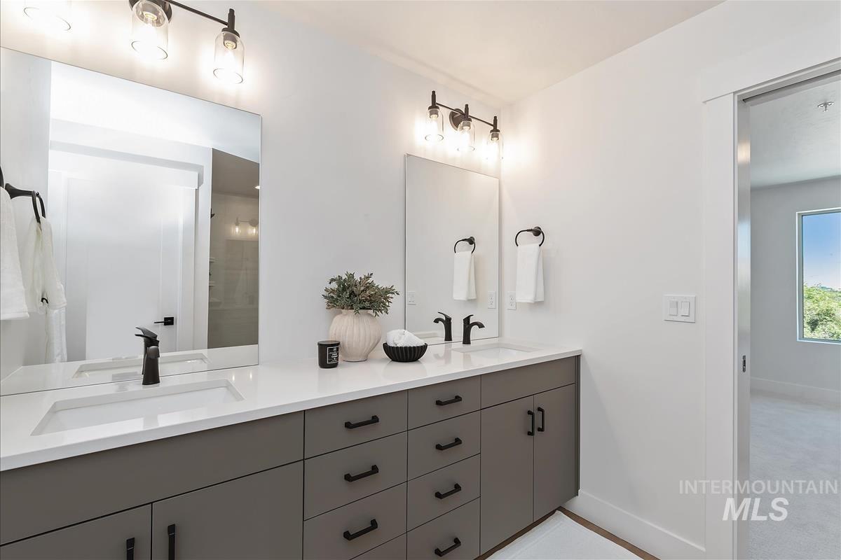 1703 South Federal Way Boise, ID 83705 - Photo 20 of 38 Bathroom featuring double vanity and baseboards