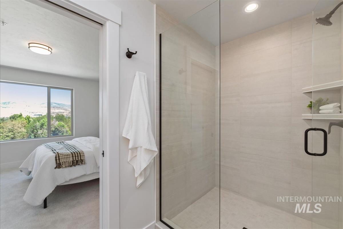 1703 South Federal Way Boise, ID 83705 - Photo 21 of 38 Ensuite bathroom featuring a shower stall and light colored carpet