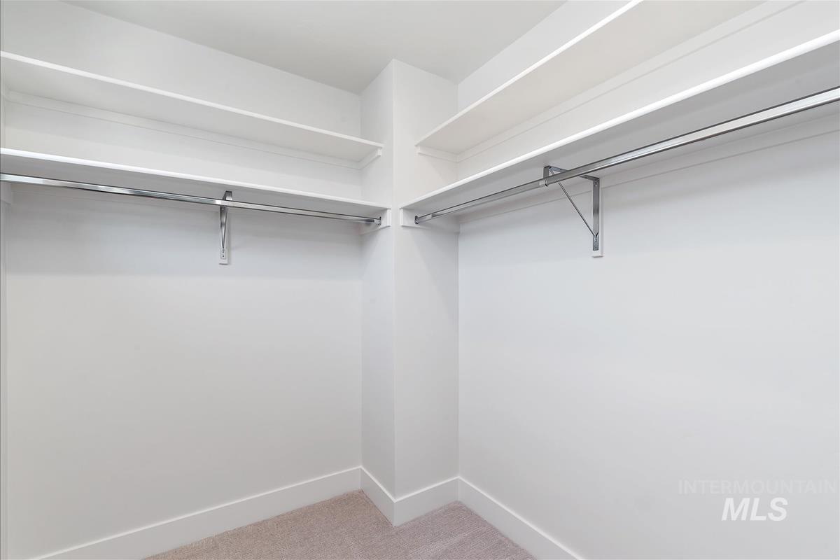 1703 South Federal Way Boise, ID 83705 - Photo 22 of 38 Walk in closet featuring light colored carpet