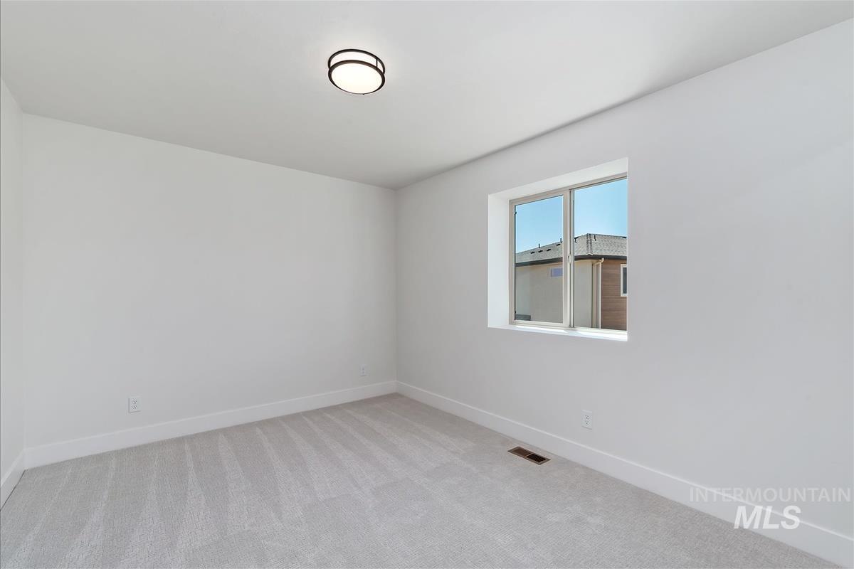 1703 South Federal Way Boise, ID 83705 - Photo 24 of 38 Unfurnished room featuring light carpet and baseboards