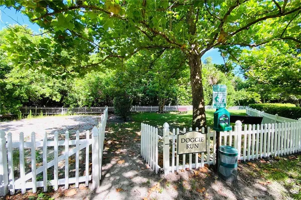 a view of a house with backyard and deck