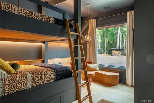 a bedroom with bed and window