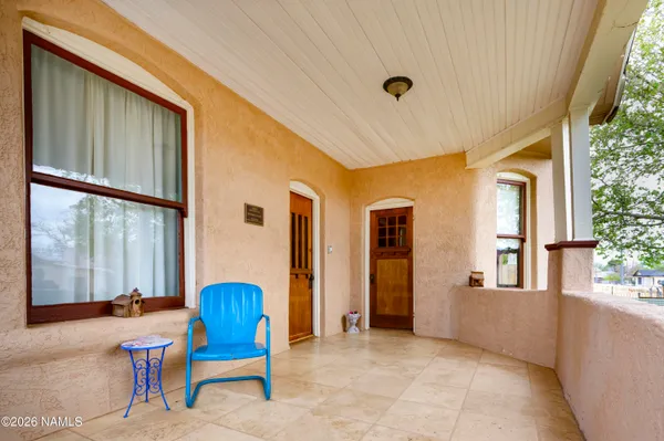 a view of a porch with chairs and couches chair with outer view
